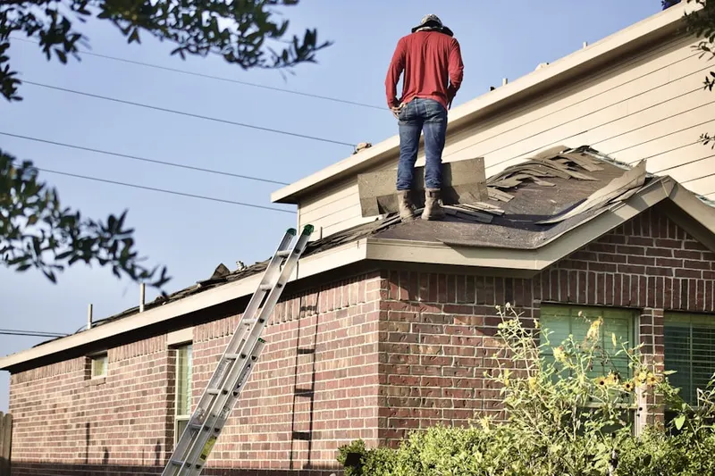 Professional roofer working on a residential roof in Fireworks